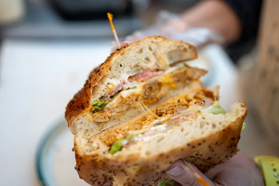 Chicken Shawarma Sandwich cut in half on house-made bread at Bernas Bakery Cafe and Restaurant Issaquah WA