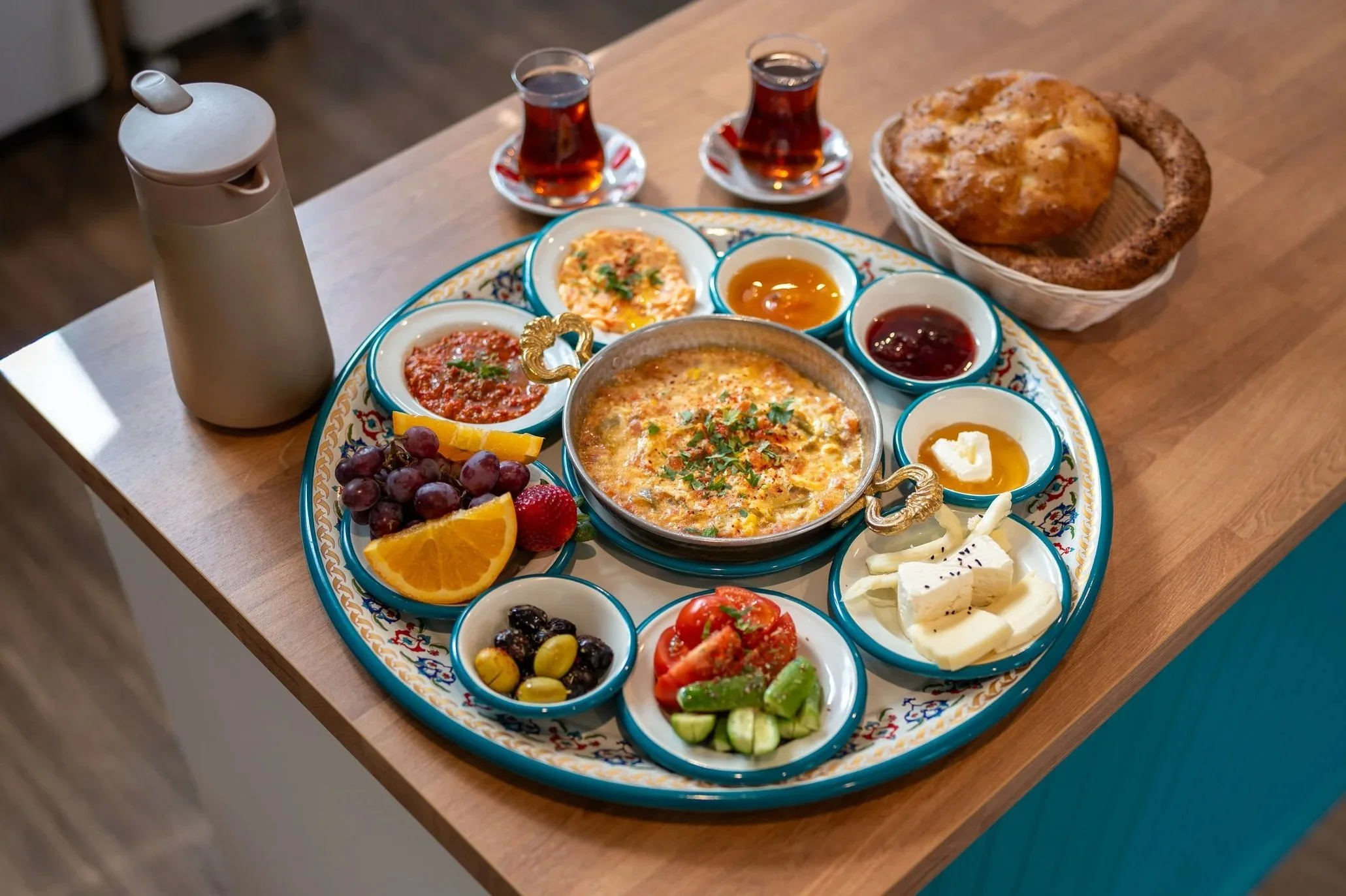 Traditional Turkish breakfast at Bernas Bakery and Cafe in Issaquah with cheeses, olives, fresh bread, fruits and tea